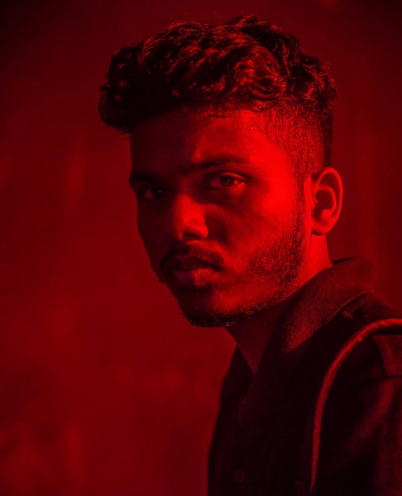 Portrait of Salman Rajesh in red light